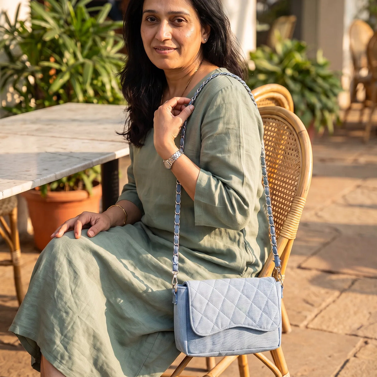 Allure Dune shoulder bag carried by a model, made from upcycled jeans