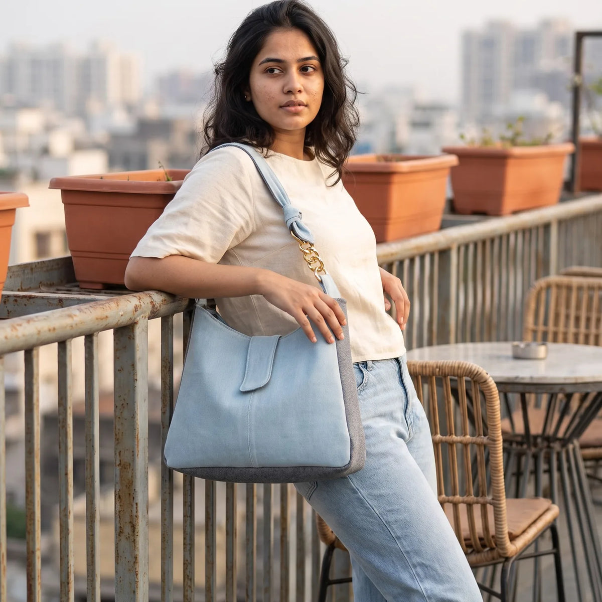Denim-Delight Classic shoulder bag carried by a model, made from upcycled jeans