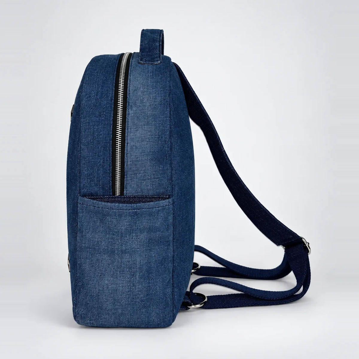 Rivet Stride Medium backpack, side with open pocket